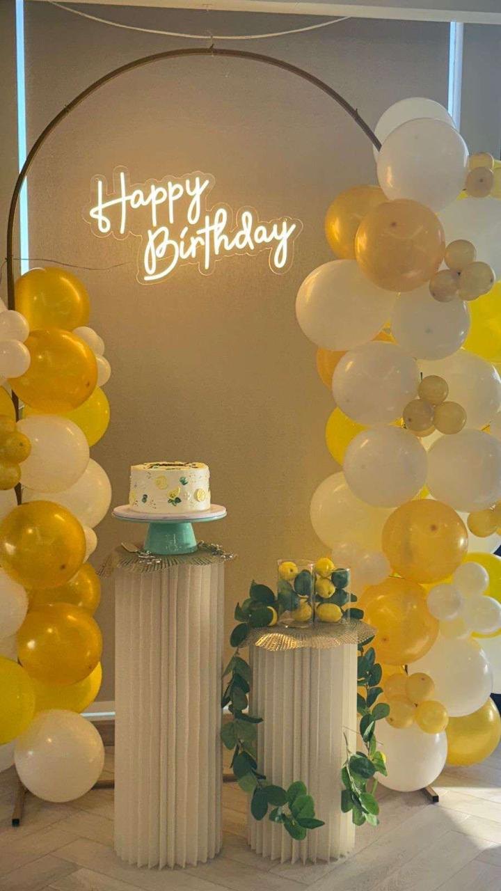 Yellow balloon birthday setup