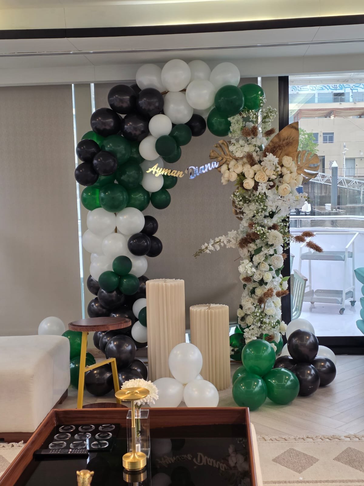 Green and black balloon event decoration