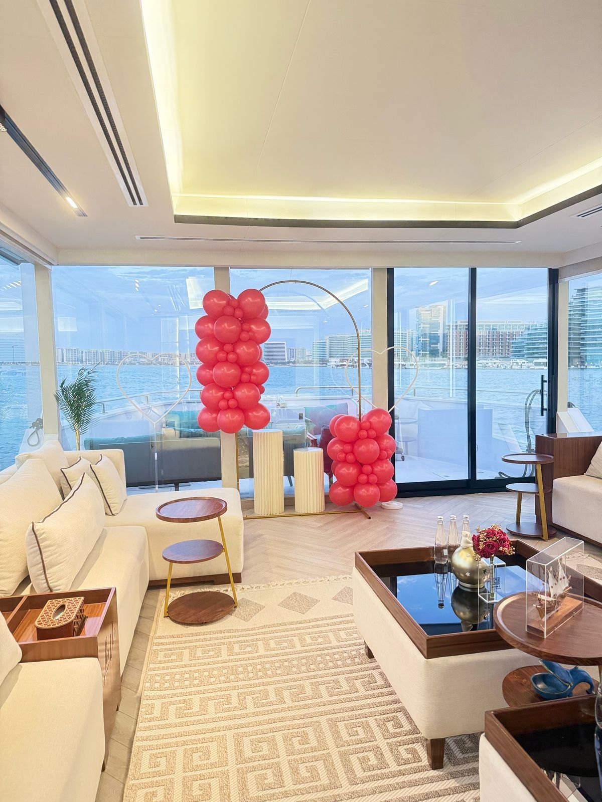 Red balloon celebration setup in the yacht lounge